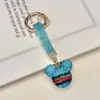 Chaveiro listrado do Mickey com diamantes completos criativo transfronteiriço, argila incrustada com diamantes, pingente de bolsa de luxo leve, chaveiro de carro