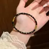 Pulsera de acero de titanio y bambú estilo coreano de lujo ligero con goteo de aceite para mujer, no se decolora, galvanizada al vacío en un horno, elegante joyería de lujo ligero