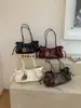 Bolsa de ombro vintage de grande capacidade 2026 nova bolsa tote de nicho estilo coreano para o dia a dia com design de cordão macio bolsa de mão