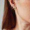 Latón chapado en oro real Europa y Estados Unidos transfronterizo caliente simple incrustado circón moda aretes para damas anillo de oreja juego de tres piezas