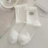 Calcetines rosas, calcetines de media pantorrilla para mujer, diseño de corazón de dibujos animados y lazo, calcetines largos elegantes para otoño e invierno, calcetines sin costuras Zhujie para mujer