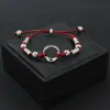 Pulseira de cordão vermelho trançado étnico estilo Xizang, pulseira de pulso com anel de paz ajustável, pulseira unissex, acessório de barraca de rua e área cênica