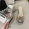 Sandalias versátiles para exteriores con correa decorativa estilo hada, nuevas sandalias con flor de cristal 2026 para mujer