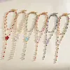 Collar multicapa de flor de resina estilo europeo y americano con gotas de aceite y diamantes, cadena de clavícula de dopamina personalizada, pulsera y collar de alta gama