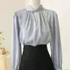 2024 nueva camisa de encaje hueco con cordones para mujer, diseño versátil, sentido de nicho, manga larga, top de camisa para mujer para ir al trabajo