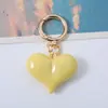 Corea del Sur Dongdaemun Moda Acrílico Amor Coche Llavero Moda Amor Colgante Chica Bolso Colgante