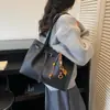 Bolso de hombro versátil de gran capacidad transfronterizo para mujer, nuevo bolso de compras casual de otoño 2026, bolso tote texturizado para el trabajo