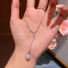 Collar de borlas de perlas con forma de serpiente y adornos de diamantes para mujer, cadena para la clavícula de acero de titanio con diseño de nicho versátil, accesorio coreano de lujo ligero