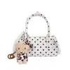 Elegante y texturizada bolsa de lunares para mujer, nuevo modelo 2026, exquisita mini bolsa cruzada versátil, moderna bolsa cilíndrica de mano