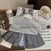 Conjunto de dos piezas para niña estilo coreano verano 2026 nuevo dulce y elegante top de punto de manga corta con patrón de diamantes y falda plisada