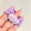 Coloridos coleteros de nuevo estilo 2026, versátiles y dulces, con accesorios de M&M's, anillos de toalla, diseños de dibujos animados y un estilo fresco y lindo, perfectos para accesorios para el cabello de niños