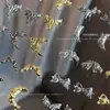 Nuevo Aleación de Arco Joyería para Uñas Líquidas Luz Destellante Diamante de Lujo Luna Mariposa Decoración de Uñas Taladro Al por Mayor