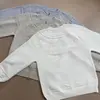 Cárdigan de punto de cachemira retro estilo americano con cuello redondo, corte casual y holgado, adecuado tanto para hombres como para mujeres, perfecto para el invierno