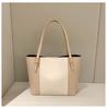 Nuevo bolso de mano de gran capacidad con diseño de bloques de colores de estilo coreano para mujer, moderno, portátil, informal, de primavera, elegante bolso de hombro.