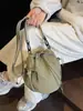 Nova bolsa de balde transfronteiriça, bolsa versátil da moda com cordão estilo japonês para mulheres, bolsa de ombro casual de alta qualidade para viagens