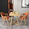 Mesa y sillas de reunión de estilo nórdico, moda italiana, lujo ligero; mesa de recepción y negociación de negocios de alta gama, mesa de ocio para patio