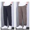 Pantalones de seda helada para hombre con diseño de raya de meteorito, que cuentan con alta elasticidad, propiedades de secado rápido, una sensación fresca y transpirable, un corte holgado y un aspecto elegante, versátil y casual, perfectos para el verano