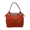 Bolsa Transversal Feminina Nova Estilo Coreano Tendência Moda Grande Capacidade Bolsa de Mão Nylon 2026 Outono Atacado Bolsa de Ombro