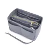 Bolsa interior de fieltro transfronteriza, bolsa de maquillaje de fieltro, bolsa de viaje para mamá con cremallera y múltiples compartimentos, bolsa de almacenamiento de cosméticos multifuncional