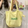 Bolsa Tote Relaxamento Feminina 2025 Novo Estilo Cordão Bolsa de Lona Commuter Leve Bolsa de Mão Grande Capacidade Bolsa de Ombro