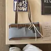 Bolso de bloques de color para mujer, bolso simple de un hombro, nuevo estilo 2026, bolso de mano de alta gama moderno, bolso versátil para el hombro