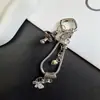 Colgante de hongo estilo Ins con goteo de aceite, cadena de teléfono de hueso de serpiente, llavero nuevo creativo de pedrería, accesorio para bolso