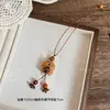 Planeta Mascota Lindo~ Ojo de Tigre Oso de Madera Perro Collar Mujer Otoño e Invierno Lindo Diseño de Nicho Cadena para Suéter Accesorios