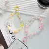 Funda para teléfono móvil color macaron con cordón estilo japonés-coreano Ins hecho a mano con cuentas de flores cadena para teléfono móvil de muñeca lazo