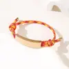 Al por mayor al contado transfronterizo Pulsera de doble cordón de ajuste Pulsera de cuerda trenzada ajustable de acero inoxidable multicolor con impresión y grabado de color UV