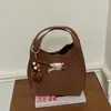 Bolso cruzado de alta gama pequeño para mujer, nuevo, retro, de nicho, tipo cubo para commuting, elegante, de un solo hombro, cruzado, moderno