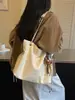 Bolsa Feminina 2026 Outono Novo Modelo Uso Diário Deslocamento Cor Sólida Simples Nicho Estiloso Grande Capacidade Bolsa de Ombro com Corrente