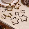 Pendientes Retro Estilo Hong Kong Otoño e Invierno Estampado Leopardo Estrella de Cinco Puntas para Mujer, Estilo Dulce y Fresco Sexy, Pendientes de Estrella de Moda y Versátiles