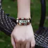 Pulsera punk europea y americana hecha a mano con cuentas de piel de vaca aleación pareja AMOR pulsera de cuero joyería comercio electrónico transfronterizo suministro