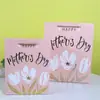 Bolsa de Regalo Blanca de Cartón para el Día de la Madre en stock Venta al por Mayor Plata Caliente 8 de Marzo Día de la Mujer Bolsa de Papel para Envolver Bolsa de Regalo para el Día de las Niñas