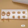 Conjunto de Dez Peças de Brincos Geométricos em Forma de Coração Plissados Metálicos Estilo Europeu e Americano, Simples e Versátil, com um Toque de Luxo