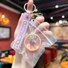 Popular Lindo Cristal Transparente Luz Intermitente Forma de Bolita Juguete para Aliviar el Estrés Llavero Colgante para Mochila de Estudiante