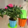 Venda por atacado vaso de flor redondo de plástico resina varanda vaso com irrigação automática armazenamento de água vaso de flor preguiçoso cor fabricantes