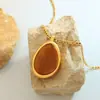 Moda Elegante Natural Estilo Tailandés Nanyang Colgante Ojo de Tigre Collar de Acero de Titanio Joyería con Cadena de Lana Otoño e Invierno