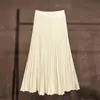 Meia-saia de tricô versátil com barra ondulada, corte A, para mulheres, primavera, outono e inverno, plissada, toque de luxo, peça externa, camada base