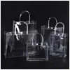 Fornecimento direto da fábrica em estoque bolsa de mão de PVC bolsa de presente de mão portátil bolsa transparente de PVC de três peças logotipo impresso