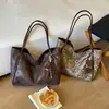 Bolso de Hombro Individual Retro Elegante de Gran Capacidad para Mujer con Estampado de Leopardo 2026 Nuevo Otoño Bolso de Mano Informal Popular para Viajar