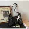 Nova Bolsa Tote Versátil Outono/Inverno 2026 Grande Capacidade Bolsa para o Dia a Dia Bolsa de Mão com Alça de Ombro Moda Versátil Bolsa Feminina