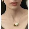 Collar con colgante de estilo emocional para mujer, con forma de fruta de marfil y bola de plata, de alta gama, de lujo, con cadena de lana.