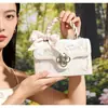 Bolsa transversal de design único, nova moda versátil de alta qualidade com textura e laço, pequena bolsa quadrada para trabalho e deslocamento