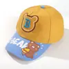 Novo boné de beisebol de menino com estampa de desenho animado, bonito, letras de urso, meninos e meninas, boné de pico, guarda-sol, chapéu de viagem para bebê