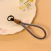Cordón corto tejido bicolor para tarjetas de identificación, llavero, accesorio universal estilo dopamina, paracord hecho a mano DIY