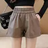 Pantalones cortos de lana de cintura alta para mujer, otoño e invierno de 2024, nuevos pantalones de estilo coreano para estudiantes, informales, adelgazantes, combinables, con botas de corte A.