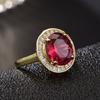 Nuevo anillo abierto elegante de alta gama con gema de turmalina roja de imitación ovalada, color oro para mujer.