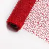 Venta al por mayor de fábrica malla jacquard de gasa floral papel de regalo floral material de embalaje para ramos red de gasa de agujero grande ganso salvaje