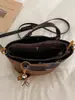 Bolso tipo cubo estilo retro para mujer, nueva colección otoño 2026, diseño coreano simple y casual, alta calidad, bolso de hombro de color liso